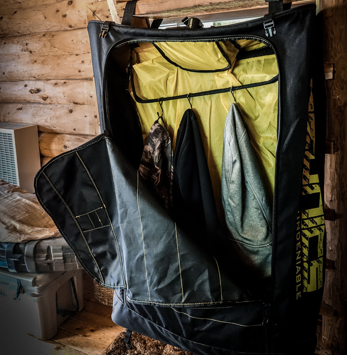 A Driwash Bag Of Clothes Is Hanging In A Room.