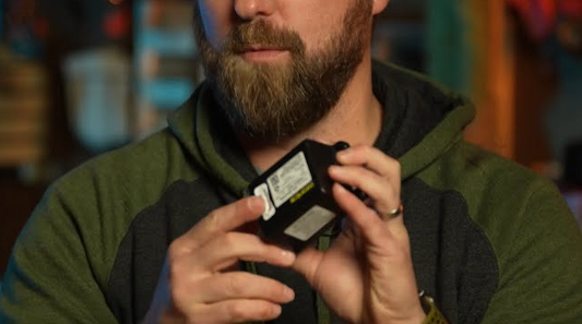 Remove sticker covering Ozonics battery terminals