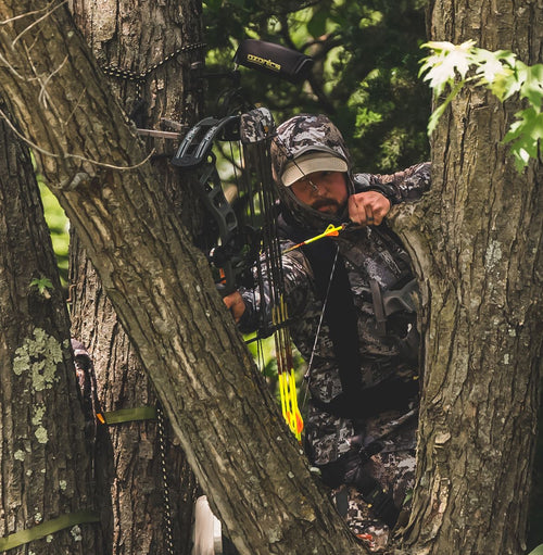 A Man In A Hunting Position On A Tree With Hr300 Installed On It.