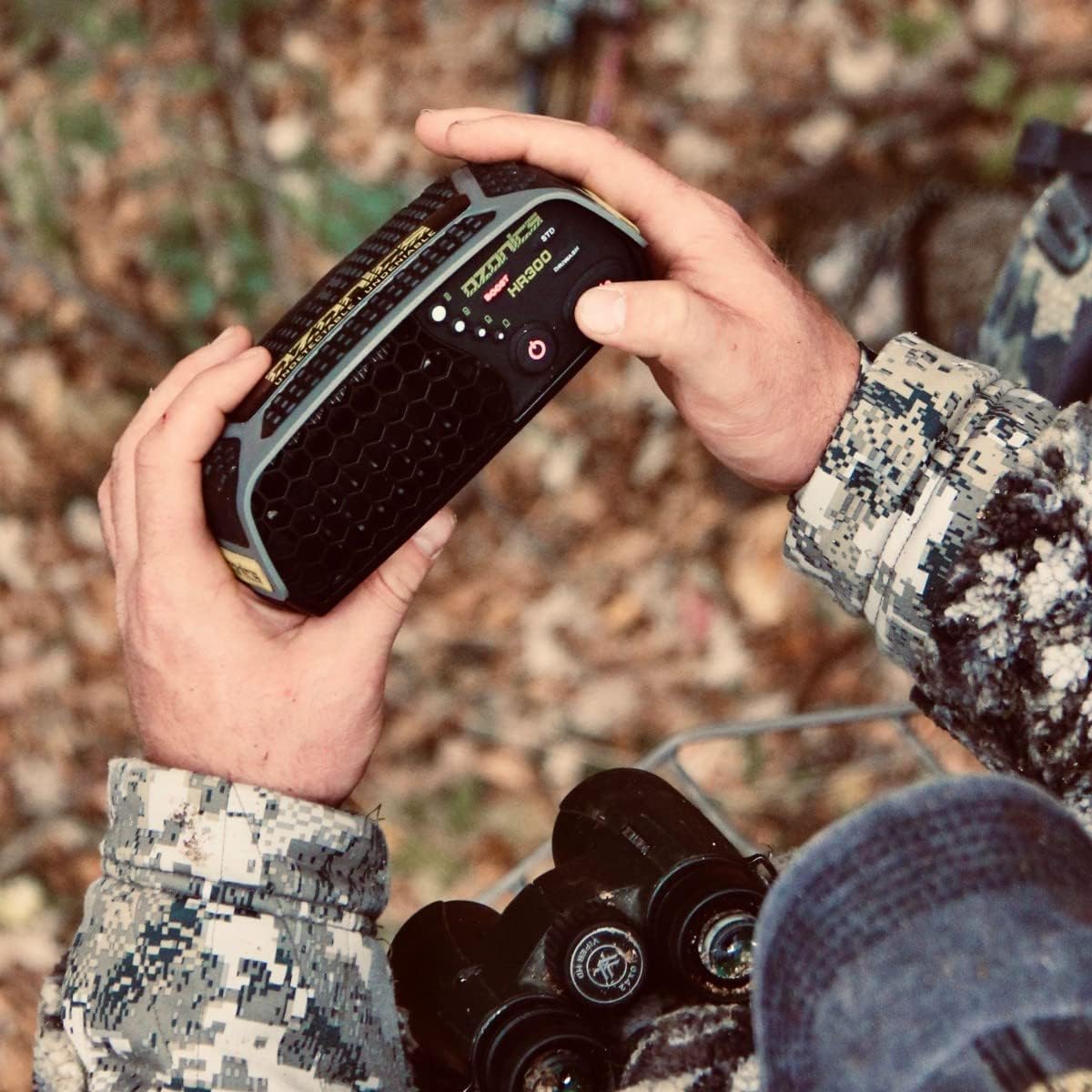 A Hunter Holding Hr300 Device And Looking At The Product Highlights